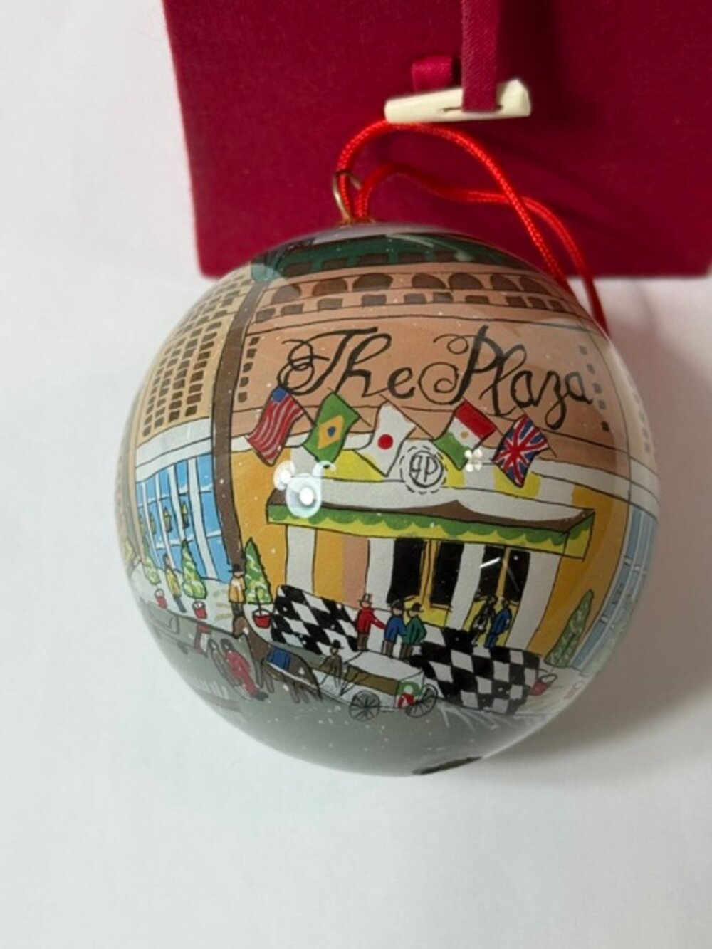 Vintage hand painted "The Plaza" Hotel glass ornament.